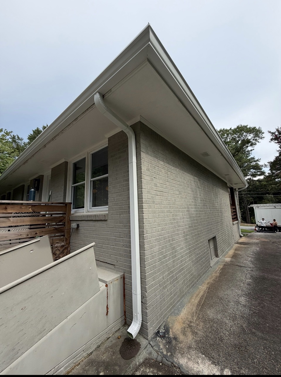 New seamless gutter and downspout installed on an Atlanta home