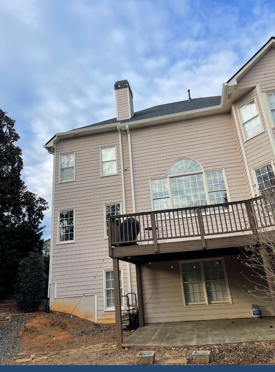 Gutter installation on a tall Roswell home